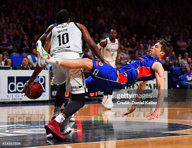Ramone Moore of Melbourne United charges Nathan Sobey of the Adelaide 36ers during the round two NBL match between the Adelaide 36ers and Melbourne...