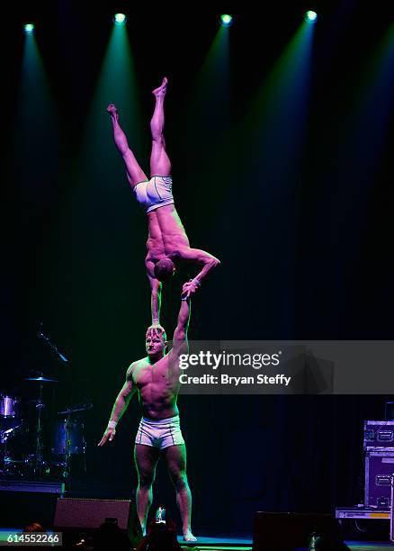 Cast members of the show "Absinthe" perform during the Scleroderma Research Foundations' Cool Comedy - Hot Cuisine fundraiser at Brooklyn Bowl Las...