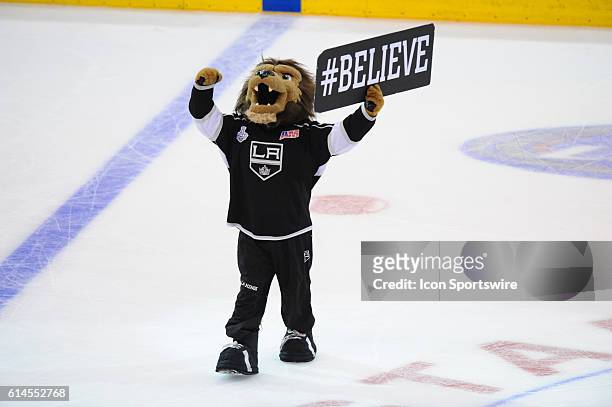 The Kings mascot Bailey holds up a #Believe sign during game 2 of the Stanley Cup Final between the New York Rangers and the Los Angeles Kings at...