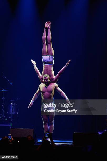Cast members of the show "Absinthe" perform during the Scleroderma Research Foundations' Cool Comedy - Hot Cuisine fundraiser at Brooklyn Bowl Las...