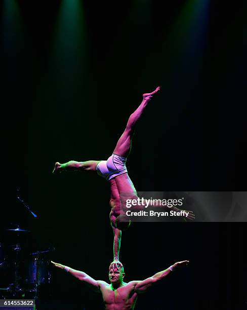 Cast members of the show "Absinthe" perform during the Scleroderma Research Foundations' Cool Comedy - Hot Cuisine fundraiser at Brooklyn Bowl Las...