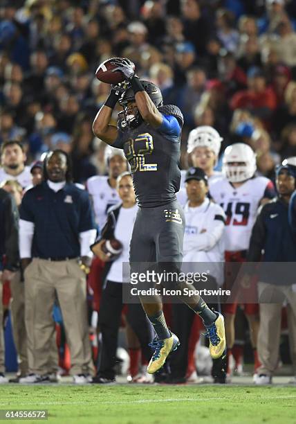 Eldridge Massington catches a pass during an NCAA football game between the Arizona Wildcats and the UCLA Bruins at the Rose Bowl in Pasadena, CA.