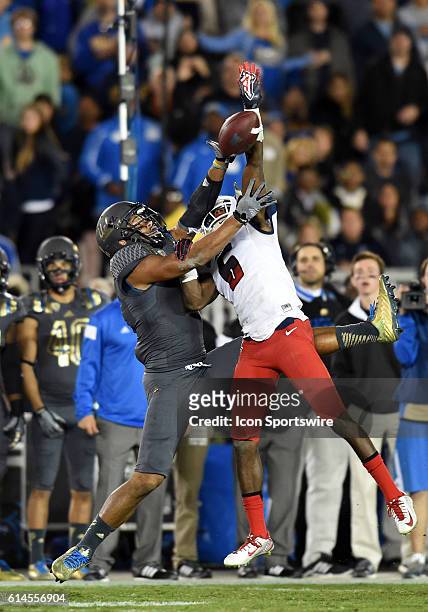 Arizona Jonathan McKnight breaks up a pass intended for UCLA Jordan Payton during an NCAA football game between the Arizona Wildcats and the UCLA...