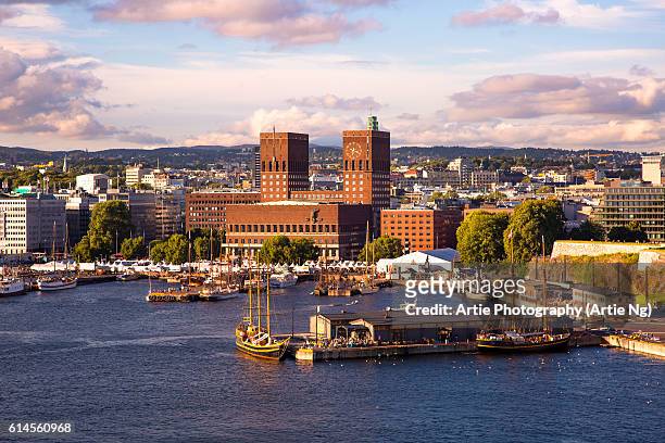 view of oslo city hall, harbourand skyline, oslo, ostlandet, norway - city hall stock pictures, royalty-free photos & images