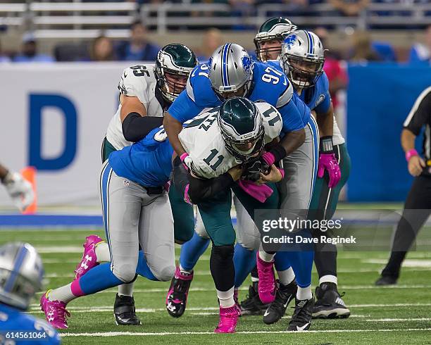 Armonty Bryant of the Detroit Lions tackles Carson Wentz of the Philadelphia Eagles during an NFL game at Ford Field on October 9, 2016 in Detroit,...