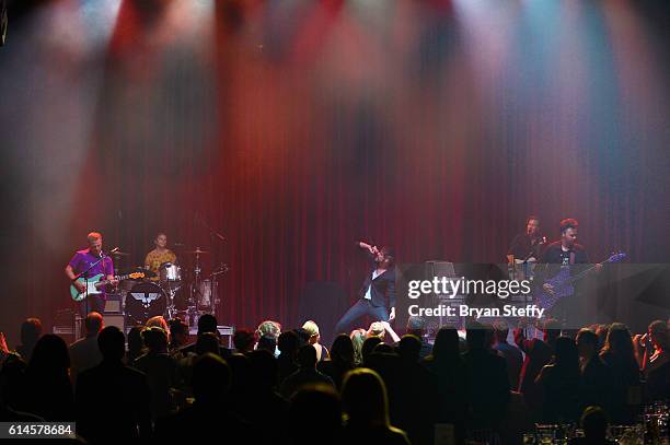 Drummer Elaine Bradley, guitarist Chris Allen, singer Tyler Glenn and bassist Branden Campbell of Neon Trees perform during the Scleroderma Research...