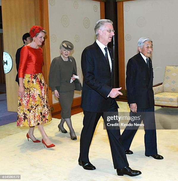 Japanese Emperor Akihito and Empress Michiko escort Belgian King Philippe and Queen Mathilde in heading to their talks at the Imperial Palace in...