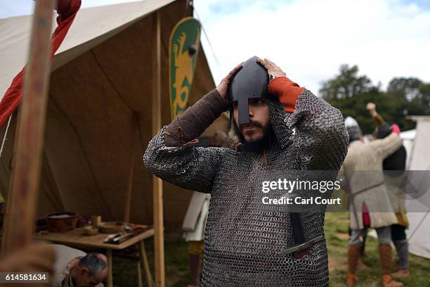 Historical re-enactors prepare to take part in a battle rehearsal ahead of a re-enactment of the Battle of Hastings on October 14, 2016 in Battle,...