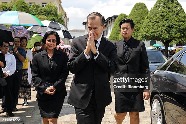 Glyn T. Davies, U.S. Ambassador to Thailand, gestures as he arrives to participate in a royal bathing ceremony the day after the announcement of the...