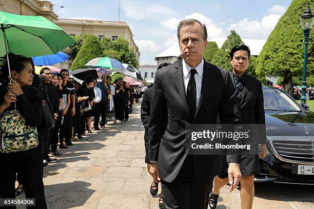 Glyn T. Davies, U.S. Ambassador to Thailand, arrives to participate in a royal bathing ceremony the day after the announcement of the death of Thai...