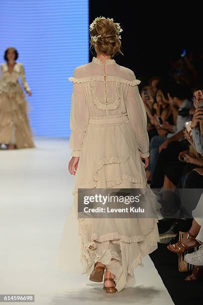 Model walks the runway at the Afffair show during Mercedes-Benz Fashion Week Istanbul at Zorlu Center on October 14, 2016 in Istanbul, Turkey.