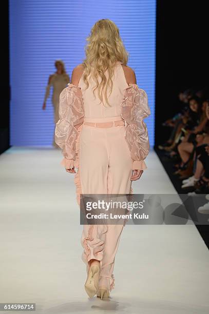 Model walks the runway at the Afffair show during Mercedes-Benz Fashion Week Istanbul at Zorlu Center on October 14, 2016 in Istanbul, Turkey.