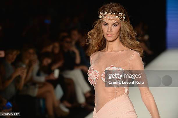 Model walks the runway at the Afffair show during Mercedes-Benz Fashion Week Istanbul at Zorlu Center on October 14, 2016 in Istanbul, Turkey.