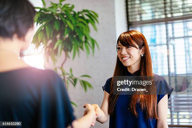 successful agreement in japanese businessman - diplomati stock pictures, royalty-free photos & images