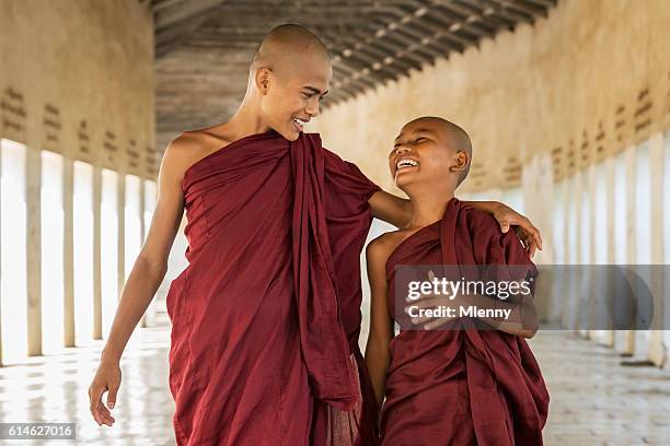 happy novice monks together bagan myanmar - monks stock pictures, royalty-free photos & images