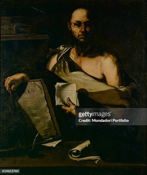 Private Collection.A philosopher lying on a book and showing a paper of notes.