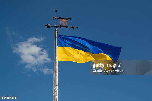ukrainian flag with the the coat of arms of the city ,lviv,ukraine - ukraine war stock-fotos und bilder