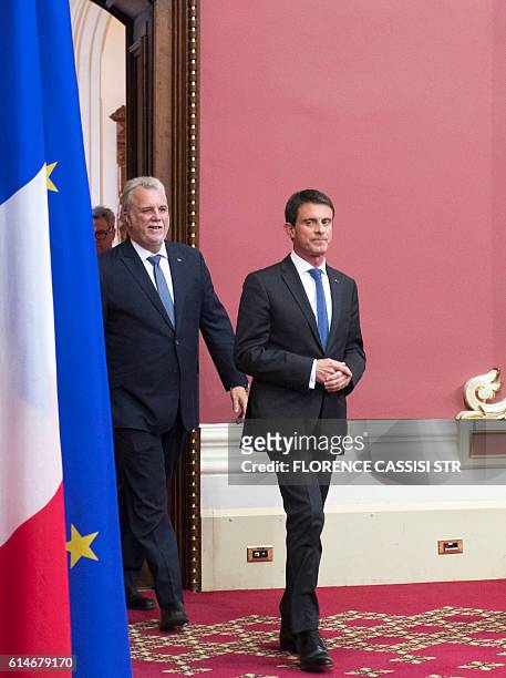 French Prime Minister Manuel Valls arrives at the National Assembly of Quebec with Quebec Premier Philippe Couillard in Quebec City, Quebec, on...