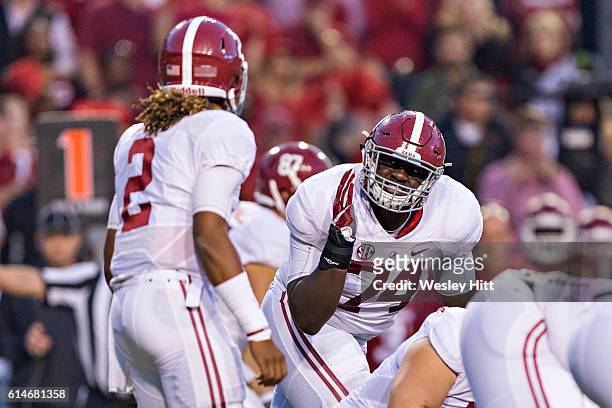 Cam Robinson of the Alabama Crimson Tide listens for the play during a game against the Arkansas Razorbacks at Razorback Stadium on October 8, 2016...