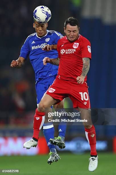 Lee Tomlin of Bristol City is challenged by Lee Peltier of Cardiff during the Sky Bet Championship match between Cardiff City and Bristol City at...