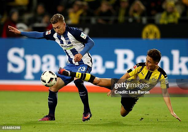 Emre Mor of Dortmund and Mitchell Weiser of Berlin battle for the ball during the Bundesliga match between Borussia Dortmund and Hertha BSC at Signal...