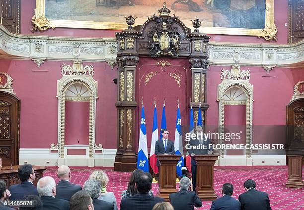 French Prime Minister Manuel Valls speaks at the National Assembly of Quebec with Quebec Premier Philippe Couillard during a press conference in...