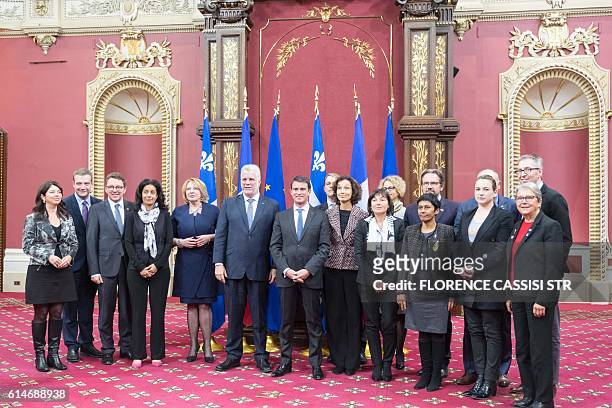 French Prime Minister Manuel Valls poses at the National Assembly of Quebec with Quebec Premier Philippe Couillardaccompanied by their delegation in...