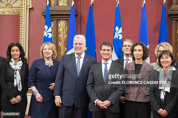 French Prime Minister Manuel Valls poses at the National Assembly of Quebec with Quebec Premier Philippe Couillardaccompanied by their delegation in...