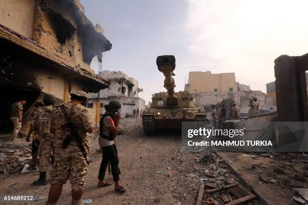 Members of the forces loyal to Libya's UN-backed Government of National Accord gather in the coastal city of Sirte, east of the capital Tripoli,...