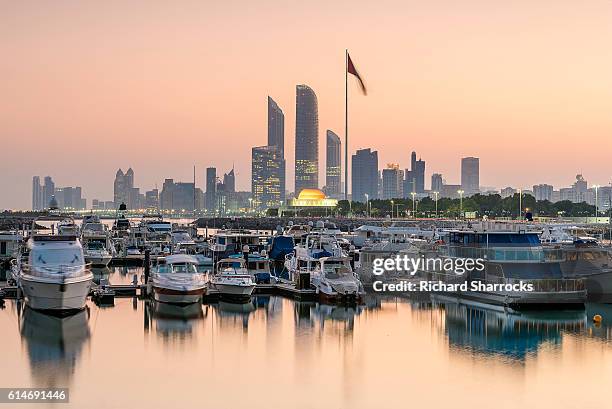 abu dhabi sunrise - abu dhabi flag stock pictures, royalty-free photos & images