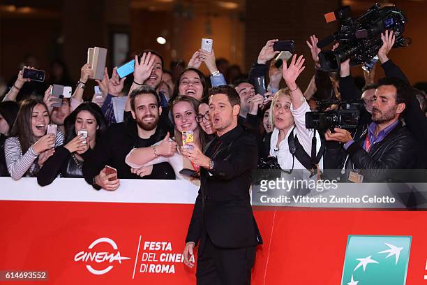 Michael Buble poses with the fans during a red carpet for 'Tour Stop 148' during the 11th Rome Film Festival at Auditorium Parco Della Musica on...
