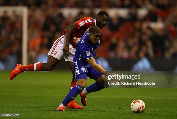 Che Adams of Birmingham holds off Mustapha Carayol of Forest during the Sky Bet Championship match between Nottingham Forest and Birmingham City at...