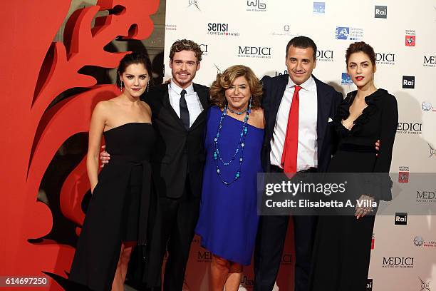 Annabel Scholey, Richard Madden, producers Matilde and Luca Bernabei and Miriam Leone walk a red carpet for 'I Medici' at Palazzo Vecchio on October...