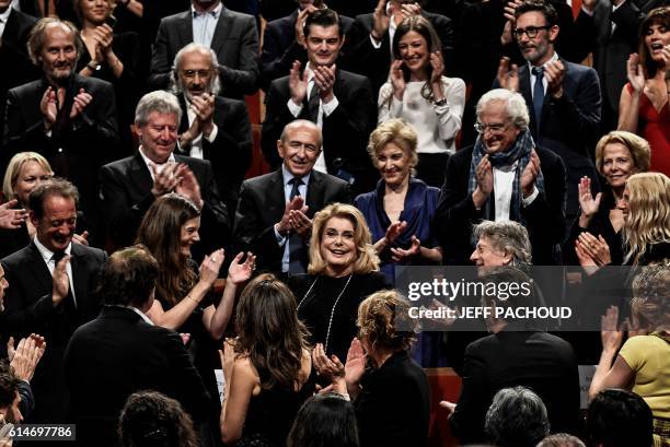 The crowd applauses French actress Catherine Deneuve as she arrives to receive the Lumiere Award, during the Eighth edition of the Lumiere Film...