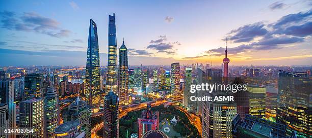 shanghai skyline sunset - shanghai world financial center stock pictures, royalty-free photos & images