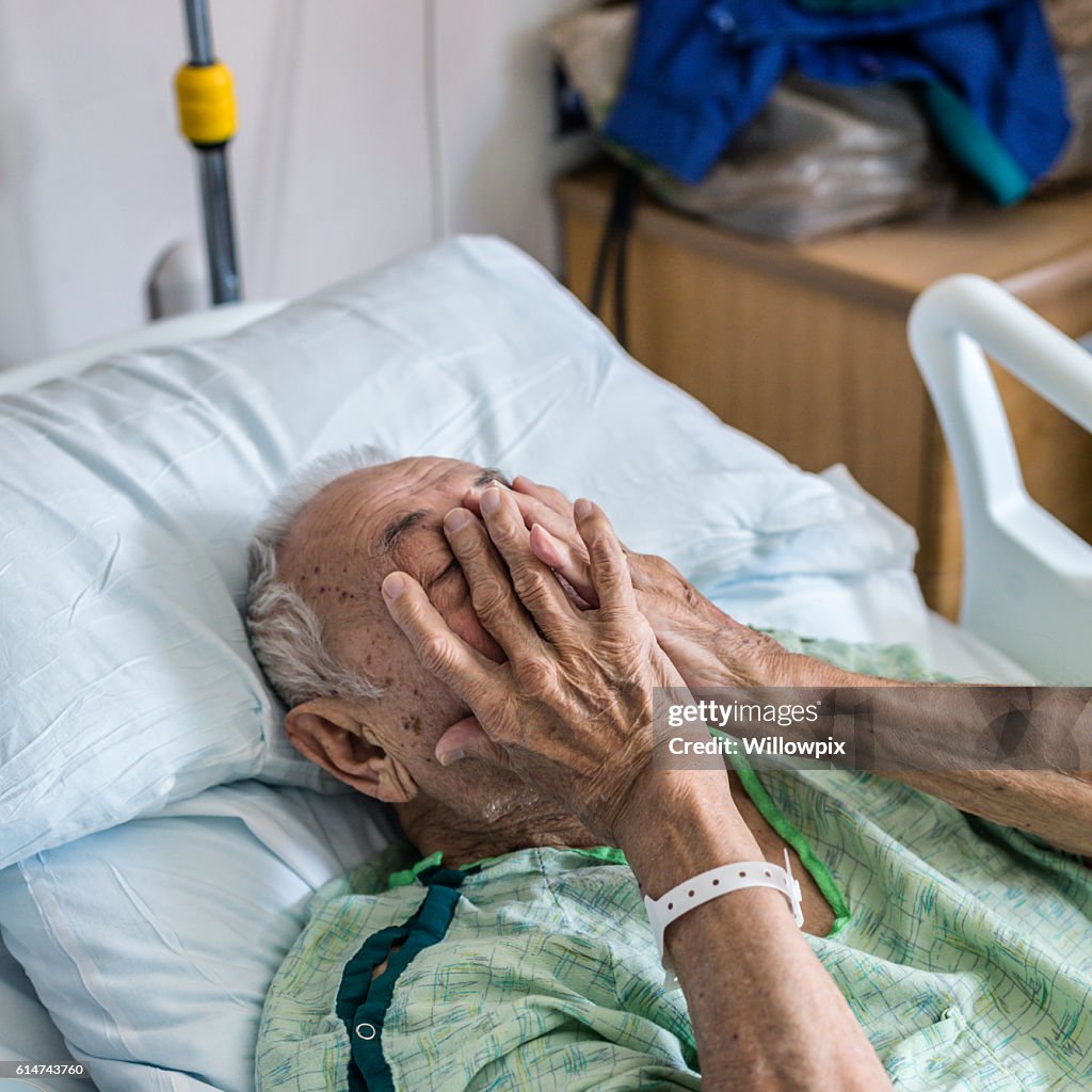 Nervous Elderly Man Hospital Patient Covering Face With Hands