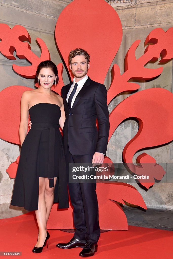 Richard Madden and Annabel Scholey walk a red carpet for 'I Medici