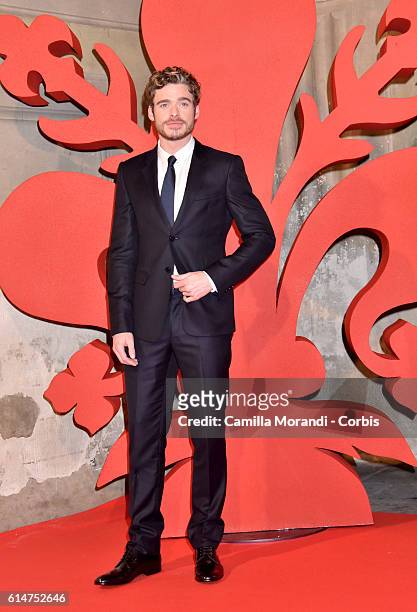 Richard Madden walks a red carpet for 'I Medici' on October 14, 2016 in Florence, Italy.
