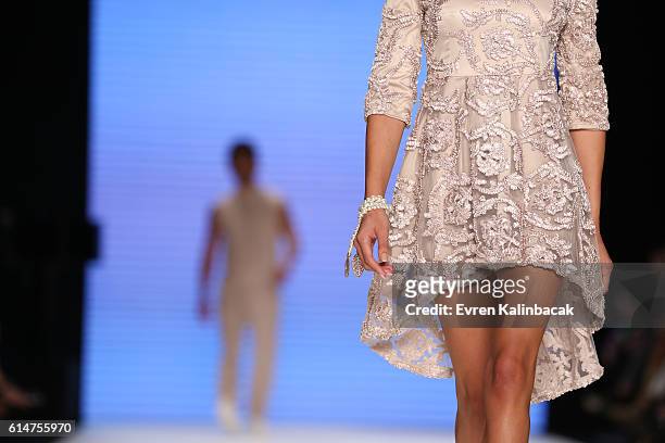 Model, design detail, walks the runway at the Afffair show during Mercedes-Benz Fashion Week Istanbul at Zorlu Center on October 14, 2016 in...