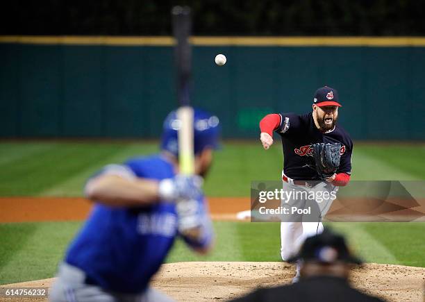 Corey Kluber of the Cleveland Indians throws a pitch in the first inning against the Toronto Blue Jays during game one of the American League...