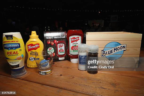 Helmann's Mayonaise, French's Mustard and Ketchup and Badia Spices' salt and pepper and a Blue Moon glass on display at the Blue Moon Burger Bash...