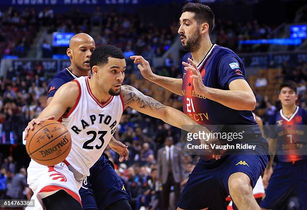 Fred VanVleet of the Toronto Raptors dribbles past Mathias Calfani of San Lorenzo de Almagro during the second half of an NBA preseason game at Air...