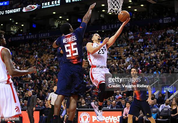 Fred VanVleet of the Toronto Raptors shots the ball as Jerome Meyinsse of San Lorenzo de Almagro defends during the second half of an NBA preseason...