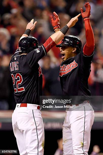 Francisco Lindor of the Cleveland Indians celebrates with teammate Jason Kipnis after hitting a two run home run to right field against Marco Estrada...
