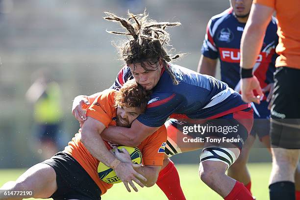 Andrew Kellaway of the Country Eagles is tackled by Reid Jordan of Melbourne Rising during the NRC Semi Final match between the NSW Country Eagles...