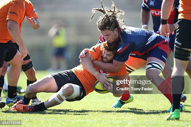 Andrew Kellaway of the Country Eagles is tackled by Reid Jordan of Melbourne Rising during the NRC Semi Final match between the NSW Country Eagles...
