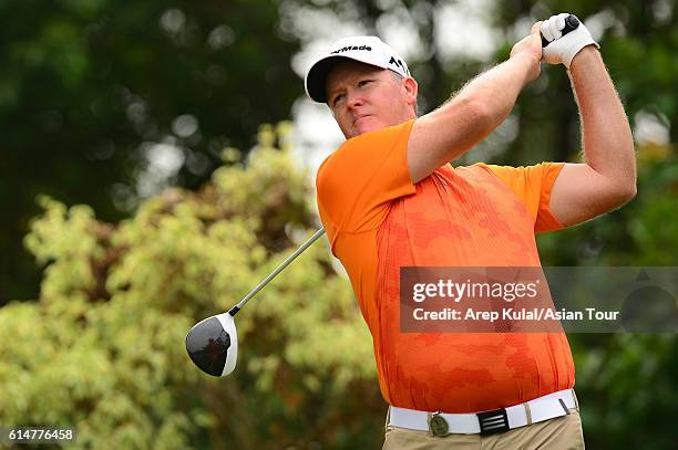 Marcus Fraser of Australia plays a shot during round three of the 2016 Venetian Macao Open at Macau Golf and Country Club on October 15, 2016 in...