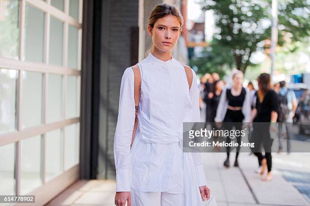 American model Zuzu Tadeushuk wears a white 3.1 Phillip Lim wrap shirt over white trousers after the Rodarte show in Chelsea on September 13, 2016 in...