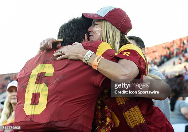 Cody Kessler hugs his mom Christie Kessler at the end of the game during an NCAA football game between the UCLA Bruins and the USC Trojans at the Los...