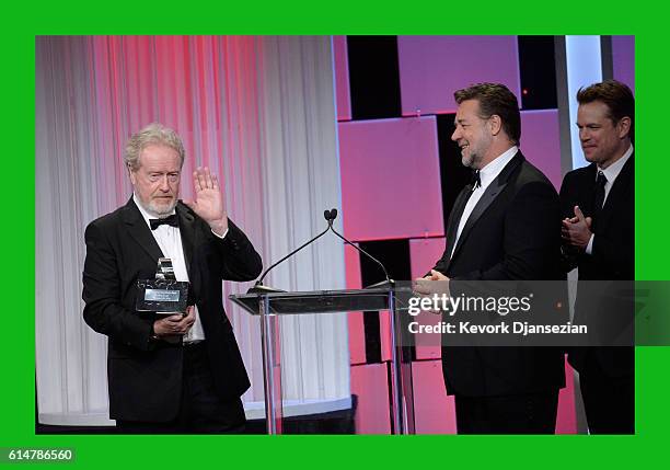 Honoree Sir Ridley Scott accepts the American Cinematheque Award from actors Russell Crowe and Matt Damon onstage at the 30th Annual American...